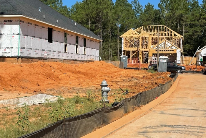 Geosynthetic silt fence for erosion control at a housing construction site